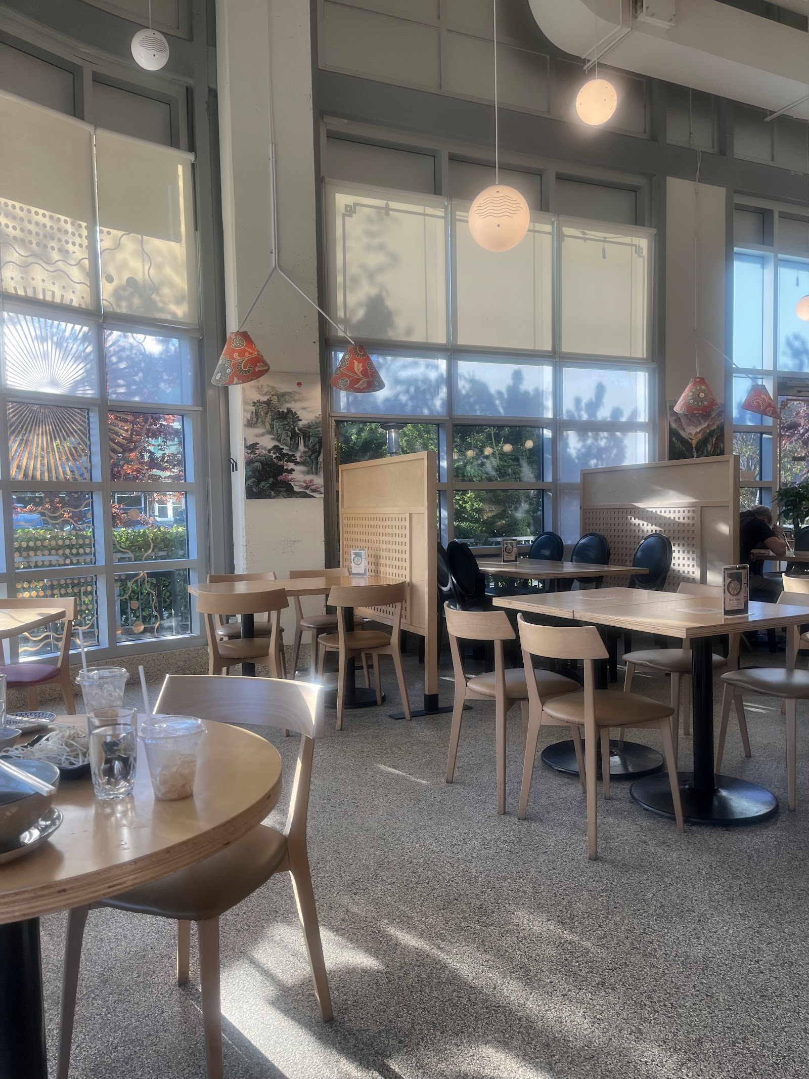 Sunlight and contemporary seating inside Co’M Cafe