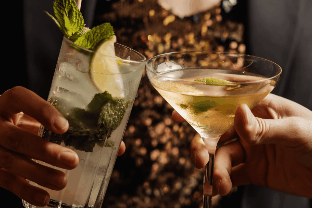 Guests raising cocktails at OVA Restaurant & Bar