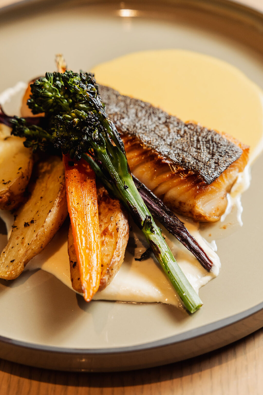 A beautifully plated fish dish at OVA Restaurant & Bar